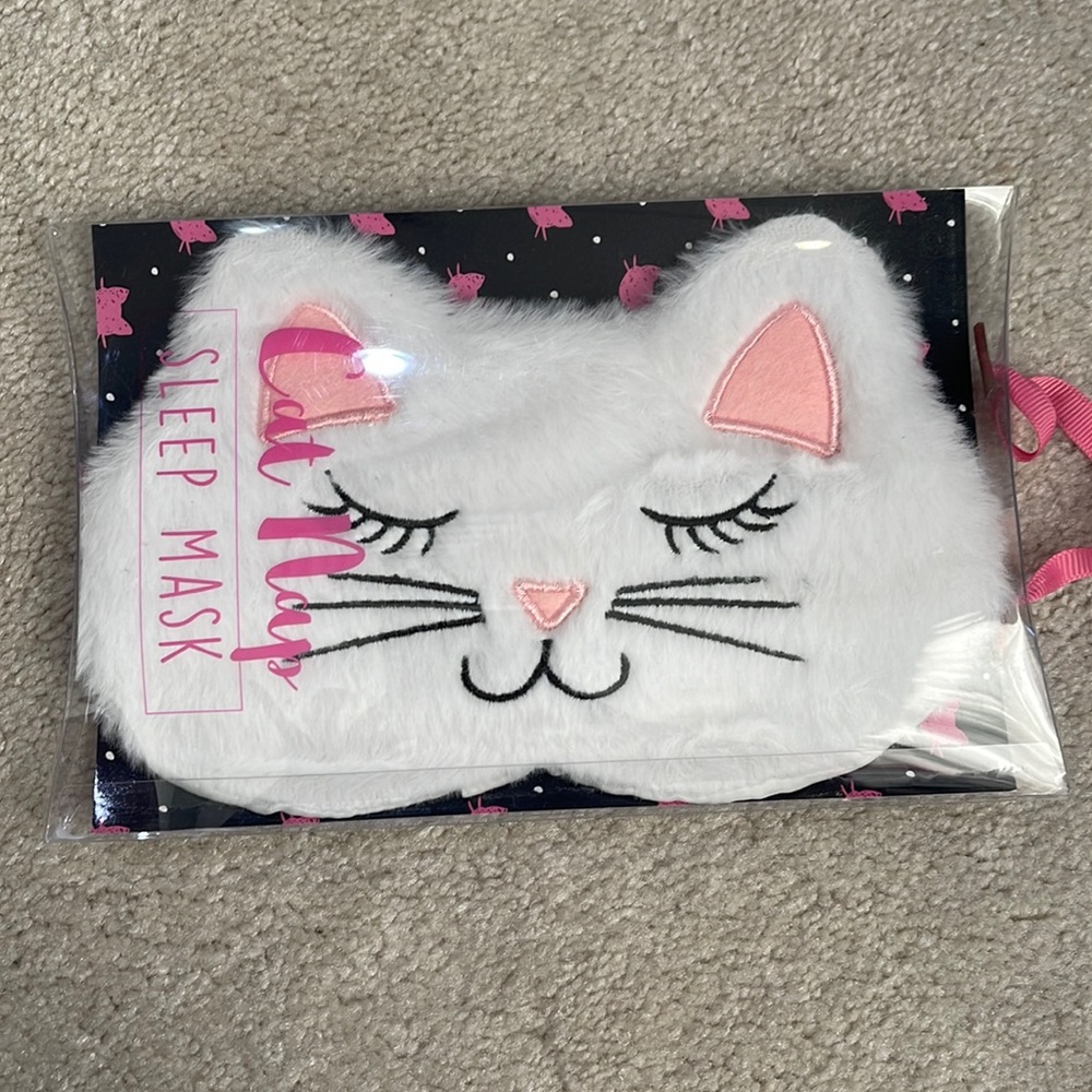 Brand new never opened or used sleep cat mask. Great for a fun gift